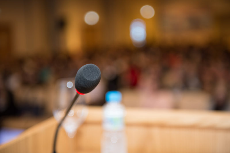 podium and microphone at a conference
