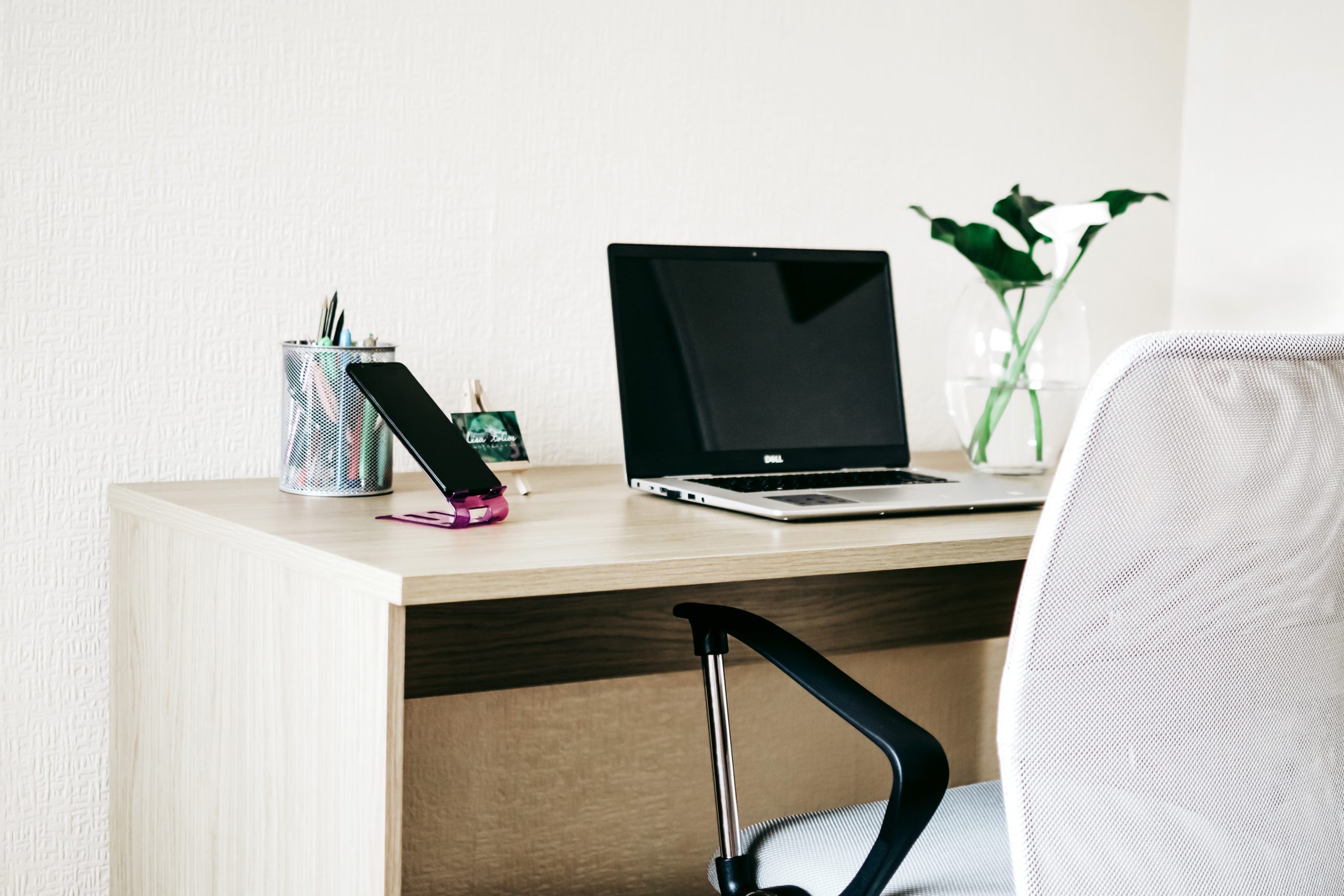 Canva Laptop Computer On Brown Wooden Desk Scaled