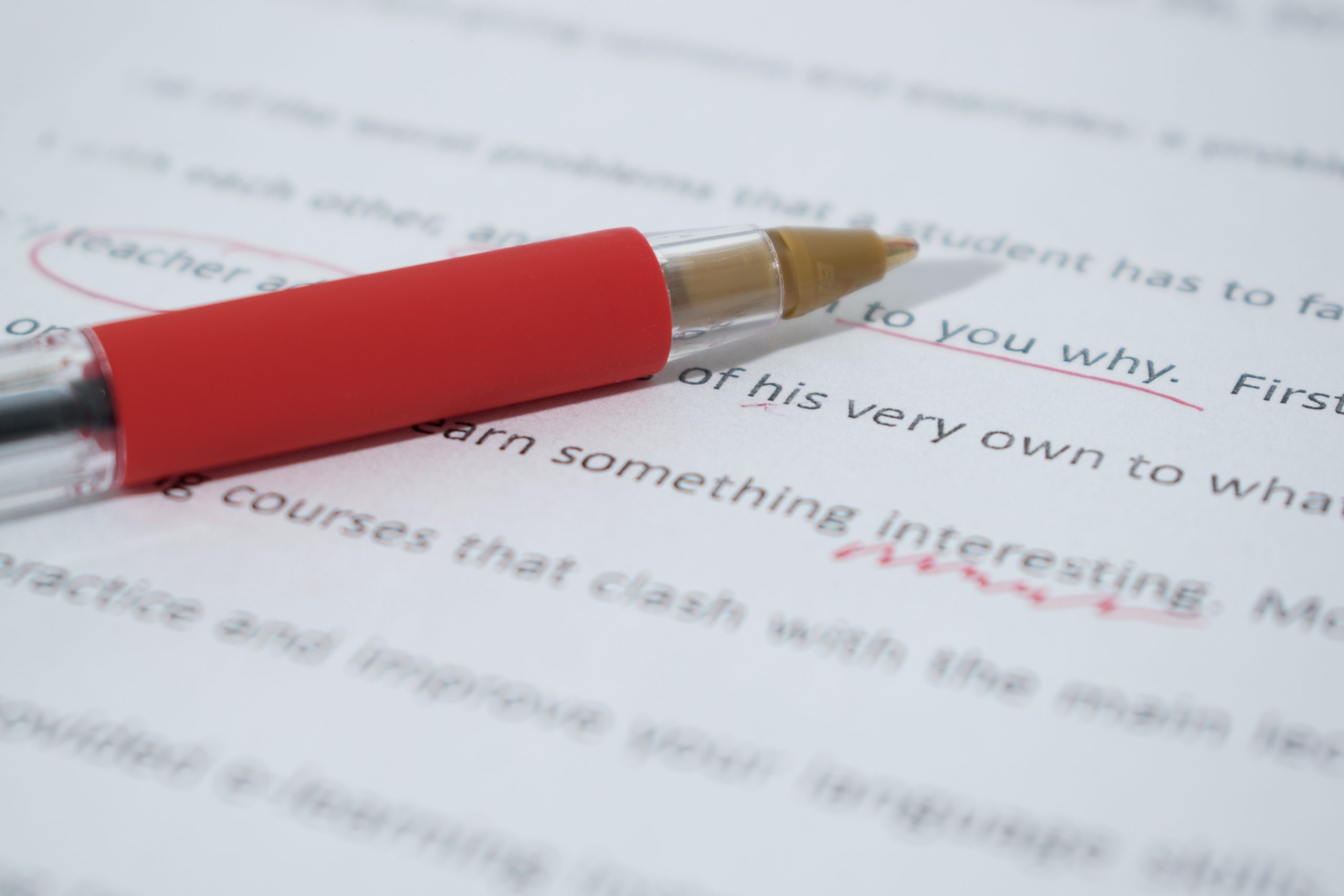Canva - Red Pen on English Grammar Text