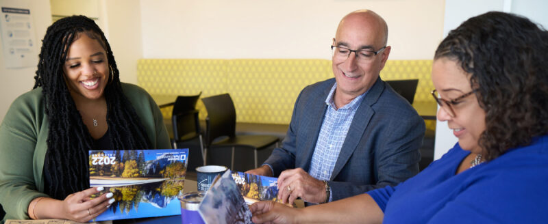 PS employees reviewing client print jobs